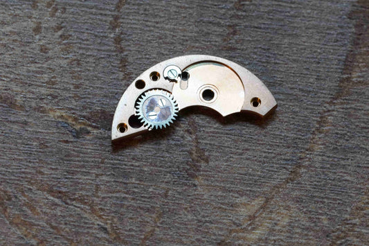 Omega cal 330 part 1001 Barrel bridge + crown wheel + spring